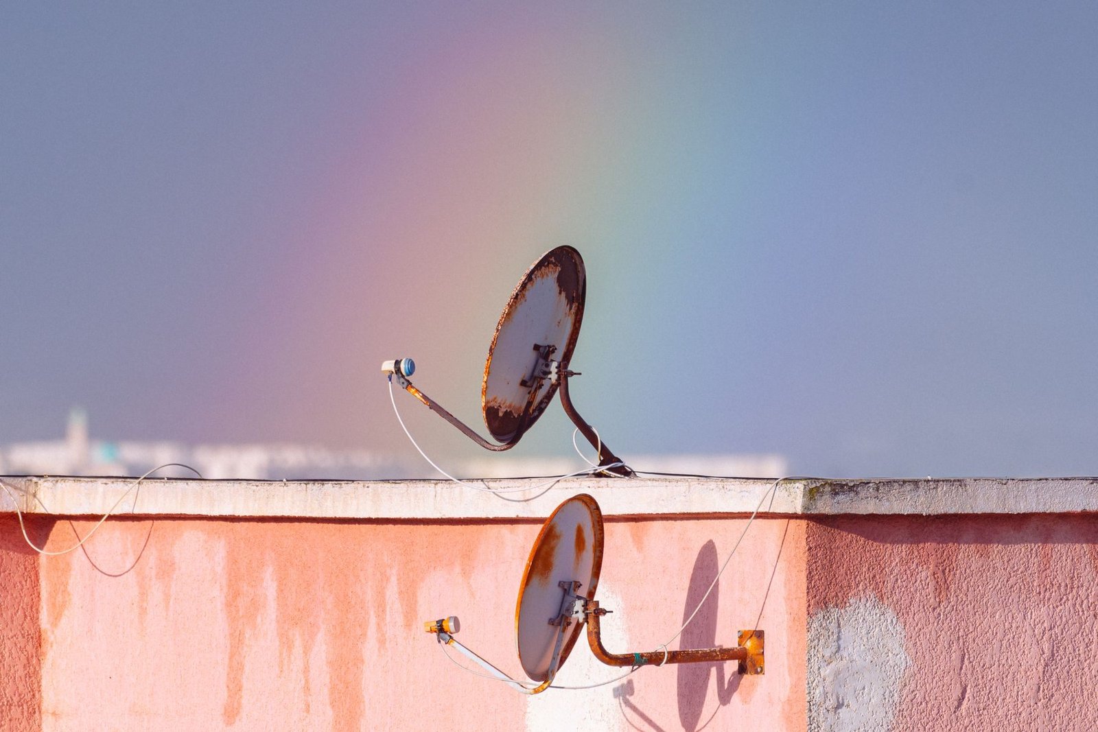 Satellite dish freshly installed on the wall of a home
